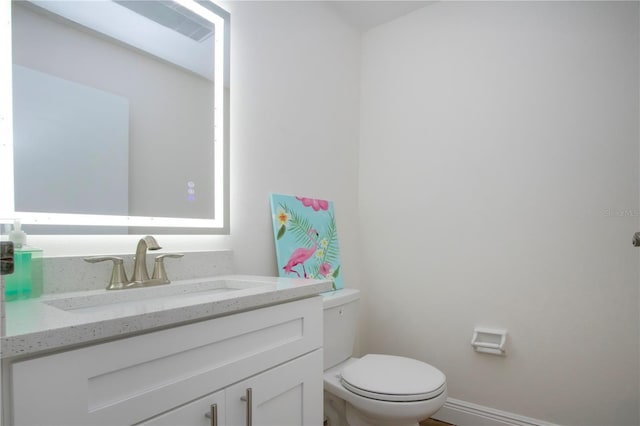 1902 Andover St Unit 198, Sun City Center, FL 33573 - bathroom featuring toilet, vanity, and baseboards