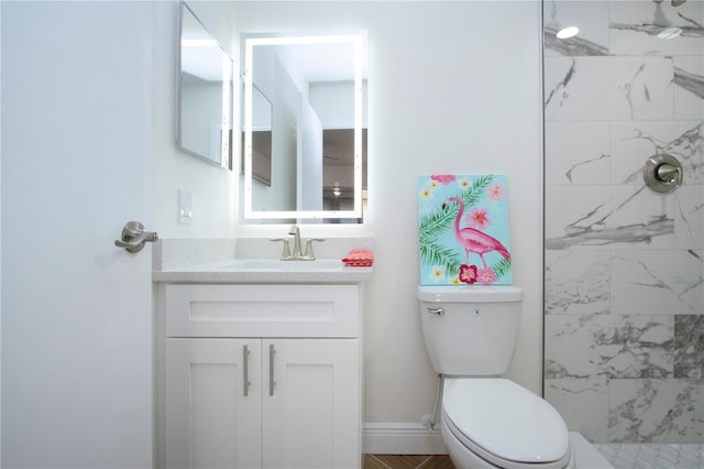 1902 Andover St Unit 198, Sun City Center, FL 33573 - bathroom featuring vanity, a tile shower, and toilet