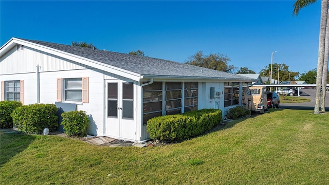 1902 Andover St Unit 198, Sun City Center, FL 33573 - back of house featuring a lawn and a shingled roof