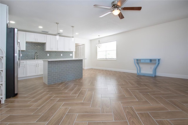 1902 Andover St Unit 198, Sun City Center, FL 33573 - kitchen with freestanding refrigerator, baseboards, a ceiling fan, light countertops, and recessed lighting