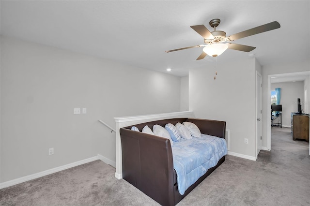 bedroom featuring ceiling fan, baseboards, and carpet floors