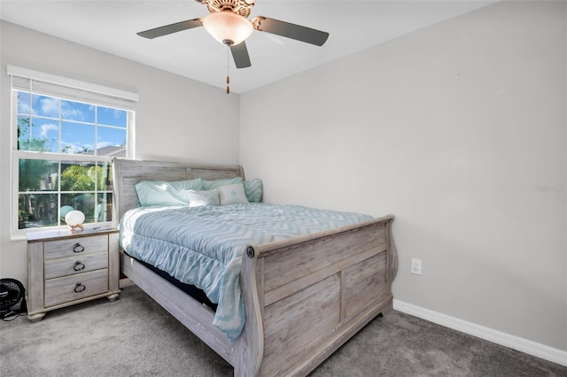 bedroom featuring a ceiling fan, carpet, and baseboards