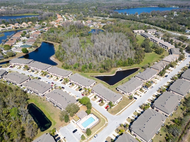 birds eye view of property with a residential view and a water view