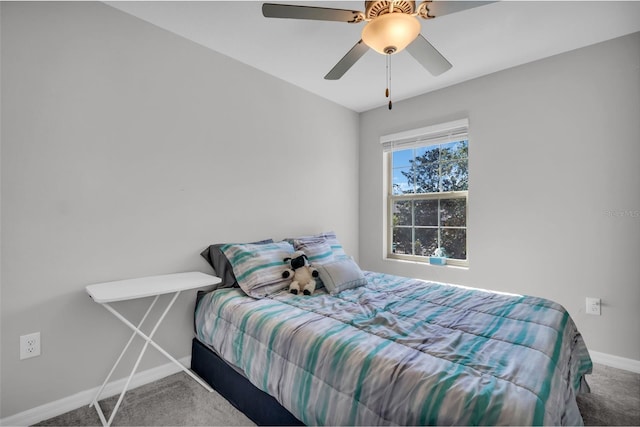 bedroom with carpet flooring, a ceiling fan, and baseboards