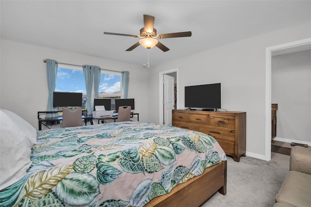 carpeted bedroom with baseboards and ceiling fan