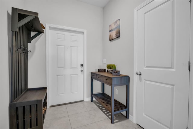 8512 Reedville St, New Port Richey, FL 34654 - mudroom featuring light tile patterned flooring and baseboards