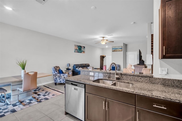 8512 Reedville St, New Port Richey, FL 34654 - kitchen featuring stainless steel dishwasher, a sink, dark brown cabinetry, ceiling fan, and light stone counters