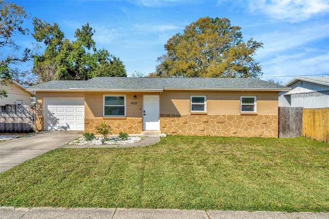 ranch-style home with driveway, stone siding, fence, a front yard, and a garage