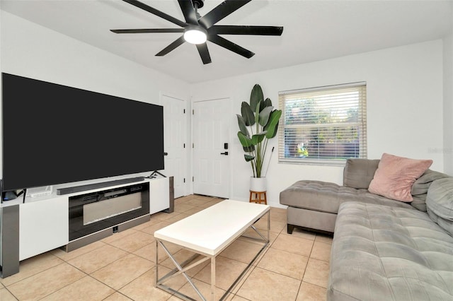 living area featuring light tile patterned floors and ceiling fan