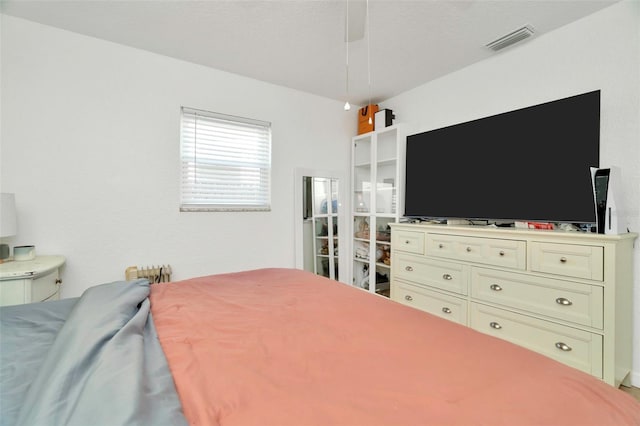 bedroom featuring visible vents