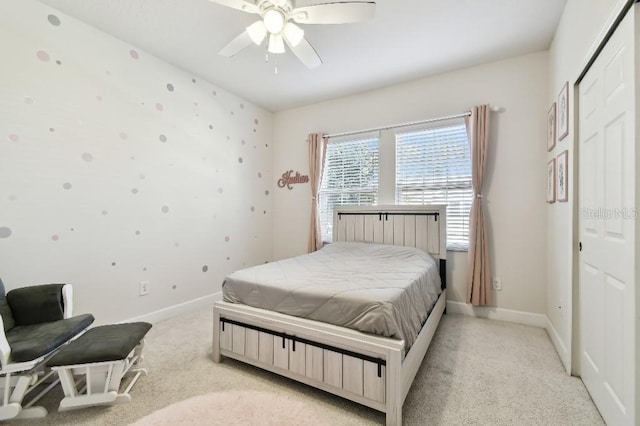 bedroom with baseboards, light colored carpet, and ceiling fan