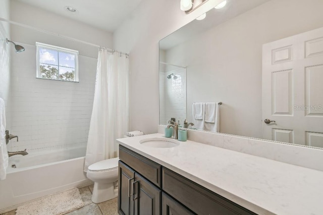 full bath with tile patterned floors, vanity, toilet, and shower / tub combo