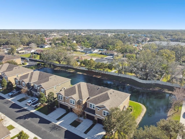 drone / aerial view featuring a residential view and a water view