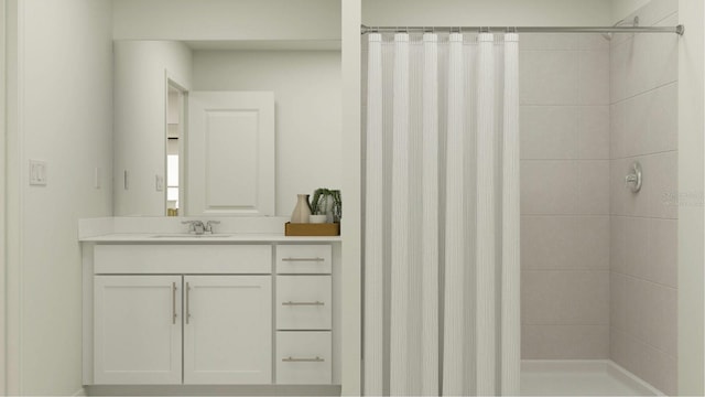 bathroom featuring tiled shower and vanity