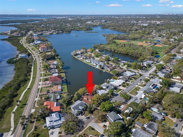 drone / aerial view with a water view and a residential view