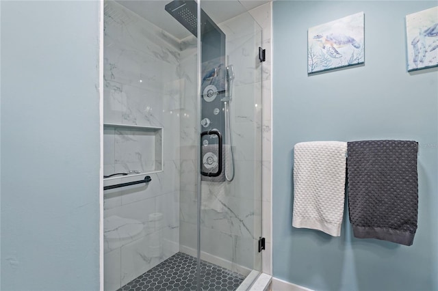 full bath with a marble finish shower