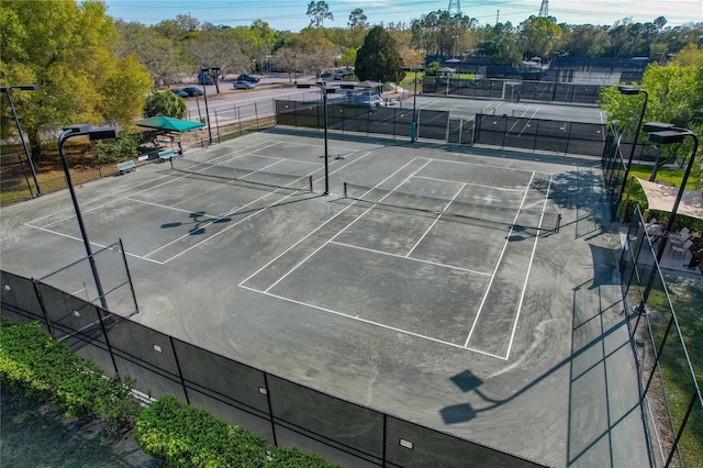 view of tennis court with fence