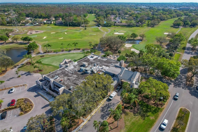 birds eye view of property featuring a water view and view of golf course