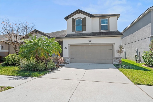 view of front of home with stone siding, stucco siding, an attached garage, and concrete driveway