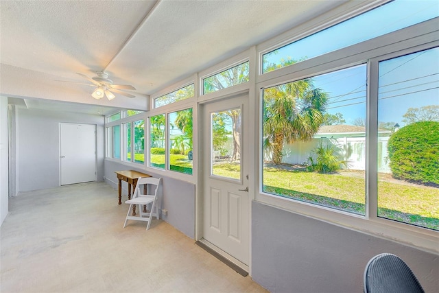 sunroom featuring ceiling fan