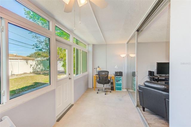 office featuring a textured ceiling, light floors, and a ceiling fan