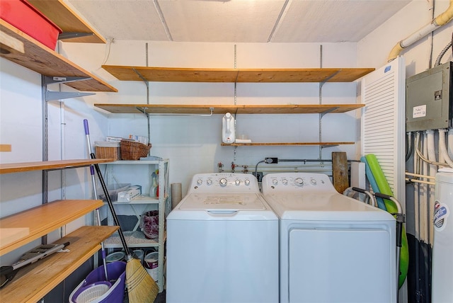 washroom with washing machine and dryer and laundry area