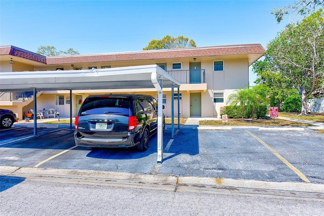 view of partially covered parking lot