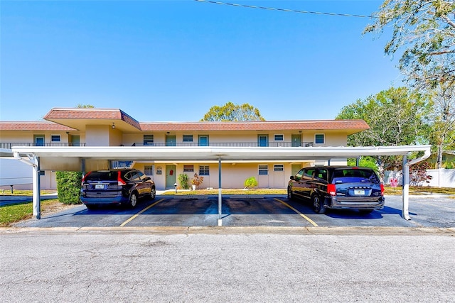 view of property featuring covered parking