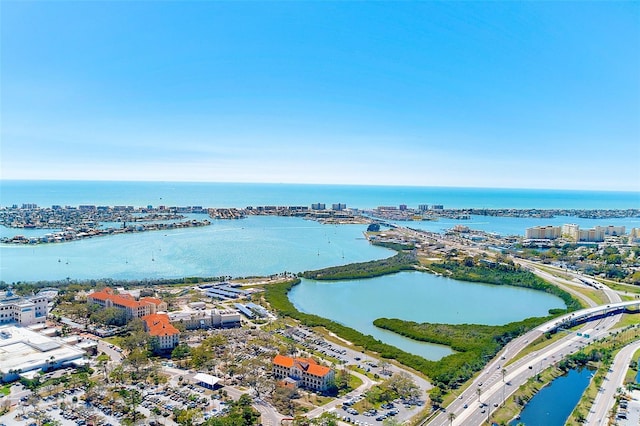 birds eye view of property with a view of city and a water view