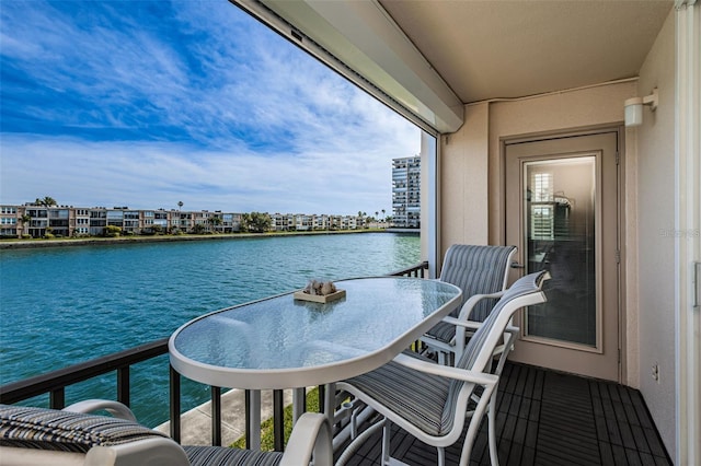 balcony featuring a water view