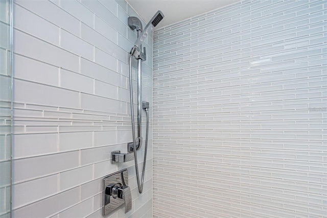 full bath with a tile shower