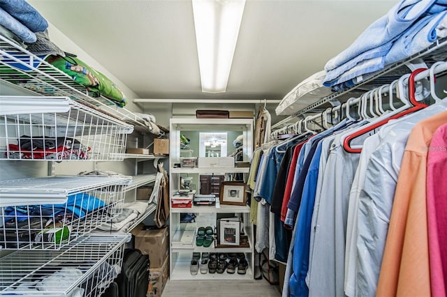 spacious closet with wood finished floors