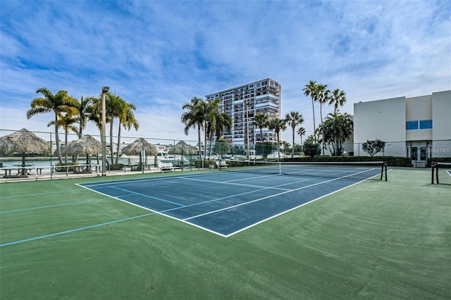 view of sport court with fence