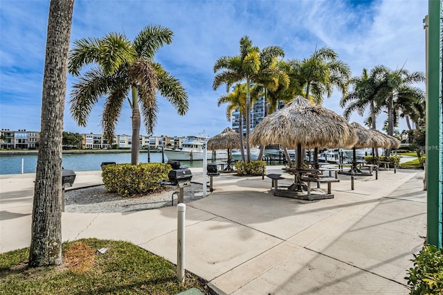 view of property's community with a gazebo and a water view