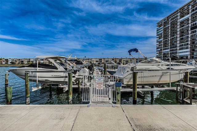 view of dock featuring boat lift and a water view