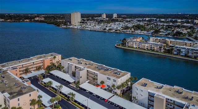 bird's eye view featuring a water view and a city view