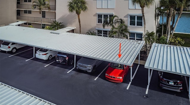 covered parking lot with a water view