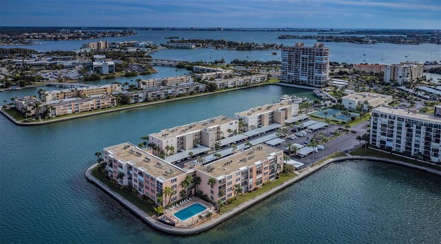 birds eye view of property featuring a city view and a water view