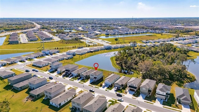 aerial view featuring a residential view and a water view