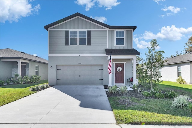 view of front of house featuring driveway, an attached garage, stucco siding, a front lawn, and board and batten siding