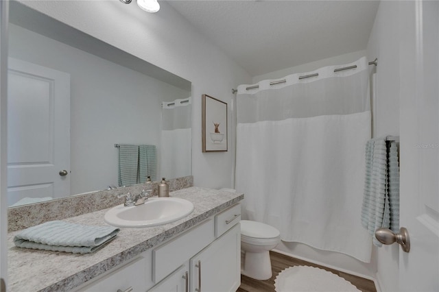 full bath featuring shower / bath combination with curtain, toilet, vanity, and wood finished floors