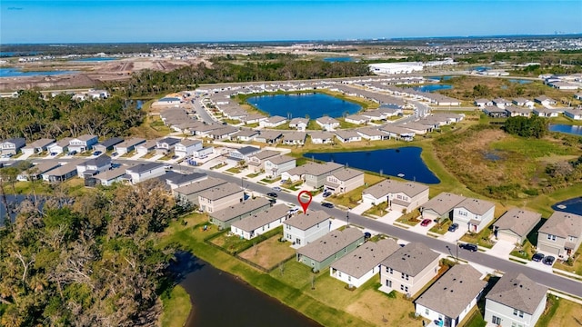 bird's eye view with a residential view and a water view