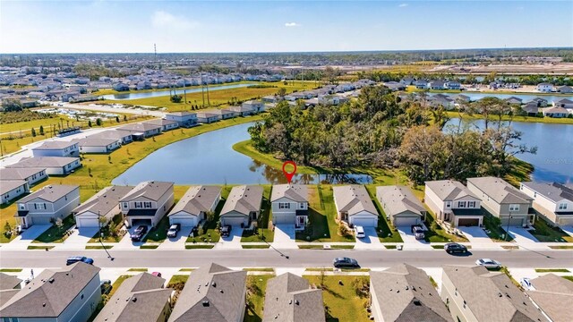 bird's eye view featuring a residential view and a water view