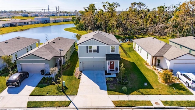 aerial view with a residential view and a water view