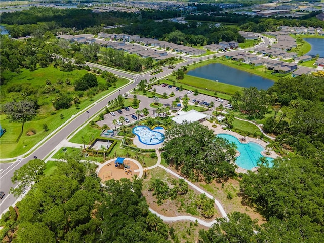 drone / aerial view featuring a water view and a residential view