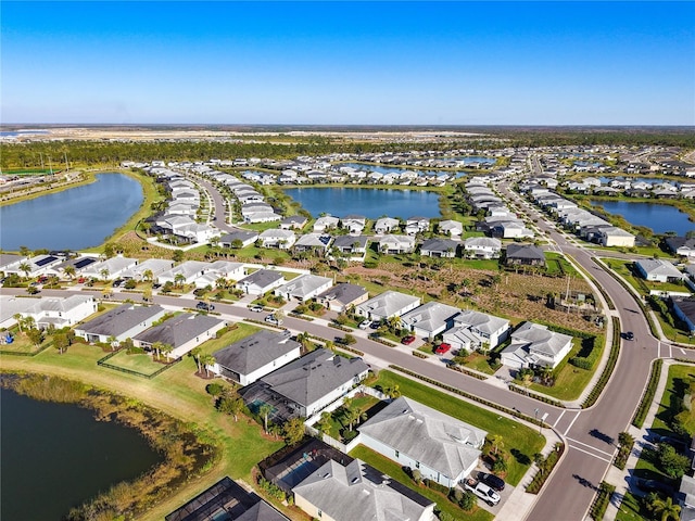 bird's eye view with a residential view and a water view