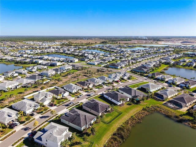 aerial view featuring a residential view and a water view