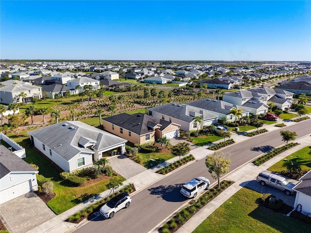 birds eye view of property with a residential view