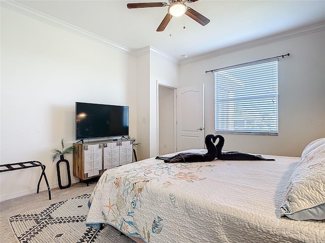 bedroom with baseboards, carpet floors, a ceiling fan, and crown molding