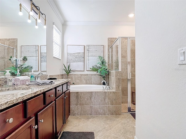 full bathroom featuring tile patterned flooring, a shower stall, crown molding, a bath, and vanity